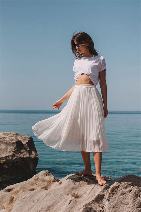 Lovely Model Posing In White Clothes By The Beautiful Sea By Stocksy