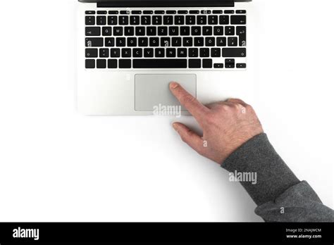 Overhead View Of Person Using Touchpad Or Trackpad On Laptop Computer On White Background Stock