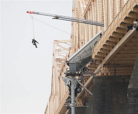 Woman Rescued From Tractor Trailer Precariously Hanging Off Louisville