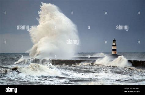 waves crash  seaham lighthouse  seaham county durham stock photo