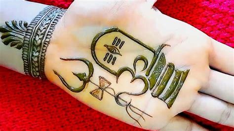 A Woman S Hand With Hendi On It And The Word Love Written In Arabic