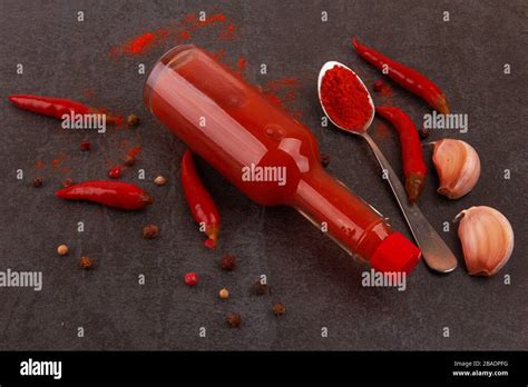 Bottle Of Spicy Red Hot Sauce On Black Background Stock Photo Alamy