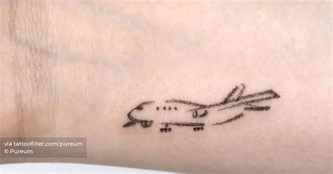 Airplane Tattoo Located On The Wrist Minimalistic