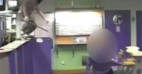 Watch Terrifying Moment Masked Thug Storms Betting Shop Brandishing A