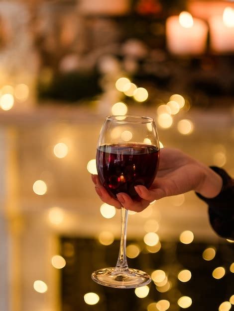 Premium Photo Woman Hand Holding A Glass Of Wine