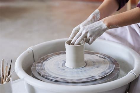 Free Photo Hands Of Unrecognizable Female Potter Making Clay Vase On