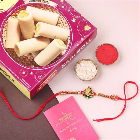 Send Sneh Ganesh Face Rakhi With Kaju Roll Online