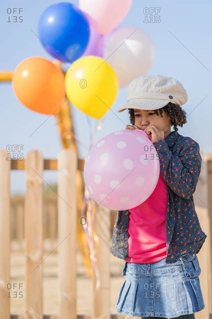 Teen Girl Popping Balloon Telegraph