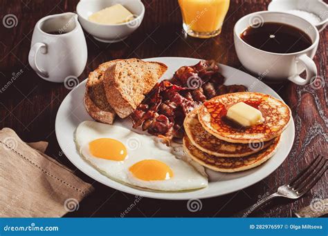 Traditional Full American Breakfast Eggs Pancakes With Bacon And Toast