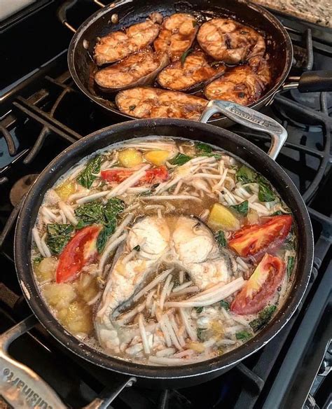 Two Pans Filled With Food Sitting On Top Of A Stovetop Next To Each Other