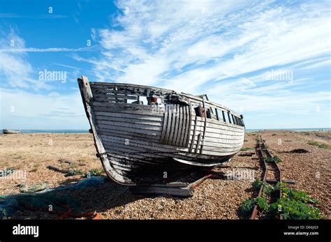 Disused Fishing Boat On The Beach At Dungeness Kent Uk Stock Photo