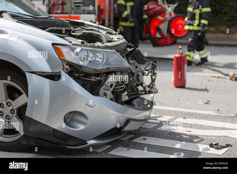 Fire Fighters At Car Crash Stock Photo Alamy