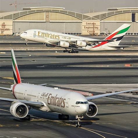 Two Airplanes Are On The Tarmac At An Airport