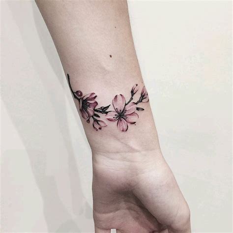 cute feminine flower armband tattoo  wrist tattoo designs  women