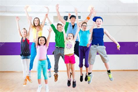 Dance teacher giving kids Zumba fitness class — Stock Photo © Kzenon #79379046