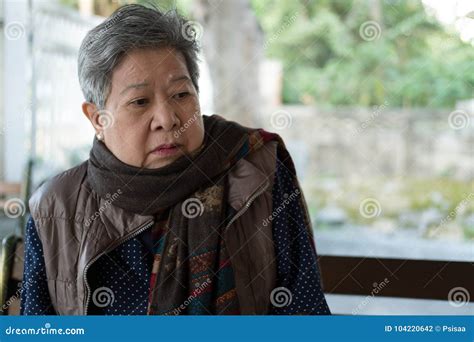 Portrait Of Elder Woman Elderly Female Senior With Bored Expression