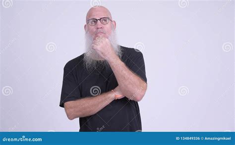 Mature Bald Bearded Man Thinking Against White Background Stock Footage