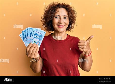 Beautiful Middle Age Mature Woman Holding Yuan Chinese Banknotes