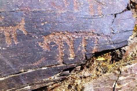 An Old Rock That Has Been Scratched And Chipped