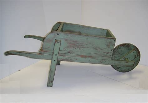 Rustic Decorative Wheelbarrow Planter Etsy Wheelbarrow Planter Wheelbarrow Rustic Wheelbarrows