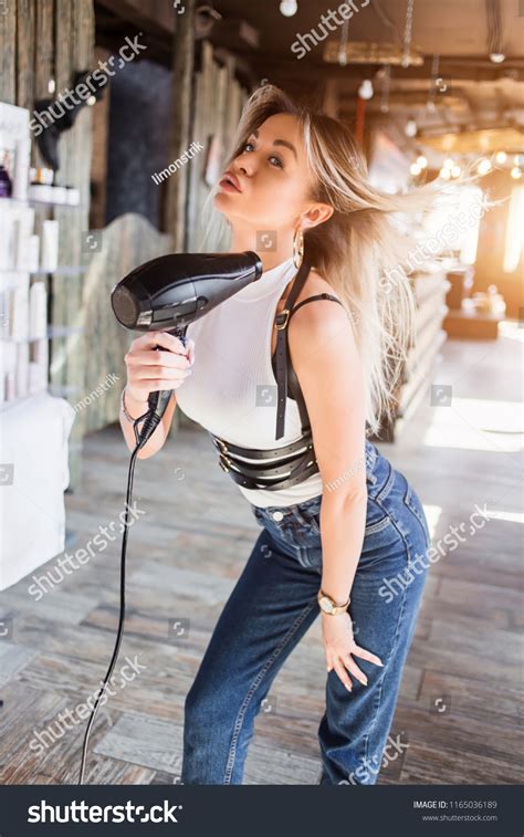 Sexy Blonde Woman Blowing Hair Dryer Stock Photo Shutterstock