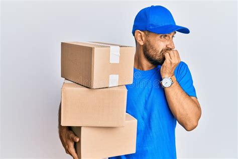 Handsome Man With Beard Wearing Courier Uniform Holding Delivery