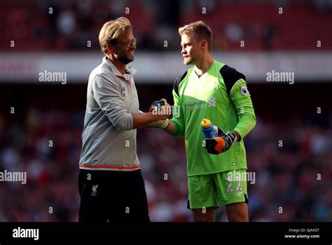 Liverpool Manager Jurgen Klopp Celebrates With Goalkeeper Simon