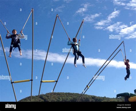 Children Bungee Jumping Stock Photo Alamy