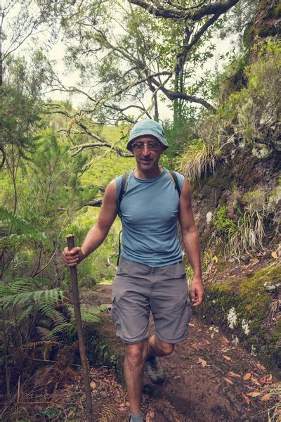 handsome adventure man hiking mountain stock  royalty