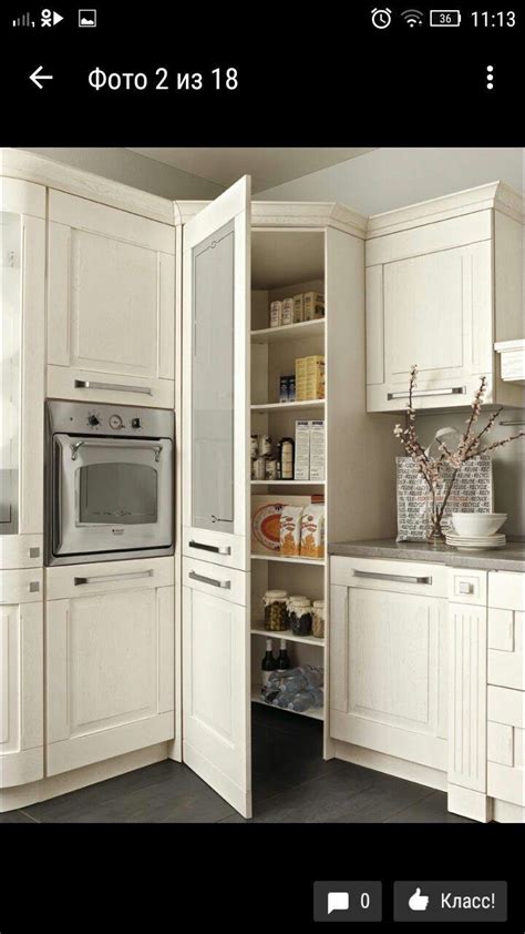 A Kitchen With White Cabinets And An Oven In The Corner Next To Some