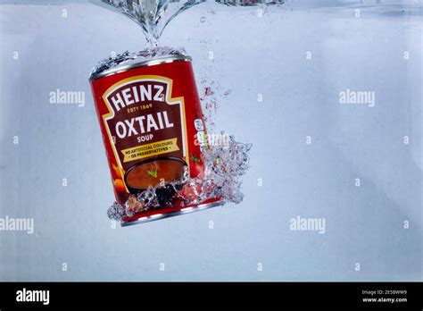 Hi Speed Shot Of A Tin Of Heinz Oxtail Soup Dropping Into Water Ultra