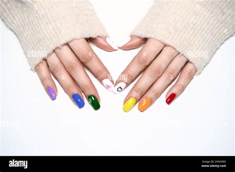 Hands With LGBT Rainbow Flag And Rose Triangle Manicure Symbol Of Lesbian Gay Bisexual