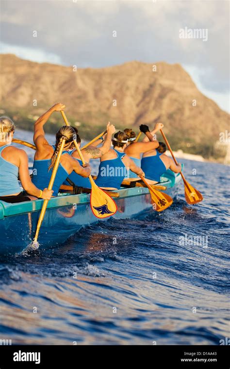 Hawaii Oahu Female Outrigger Canoe Team Paddling Towards Diamond Head