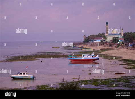 Indonesia Kupang City Coastline With Fishing Boats And Mosque Nurul