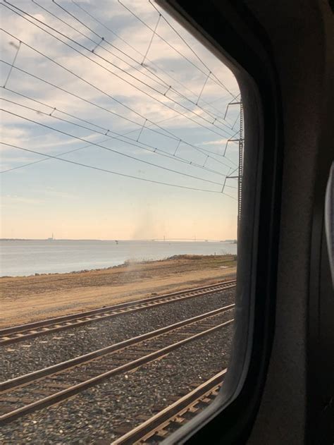 Looking Out The Window Of A Passenger Train As It Travels Down The