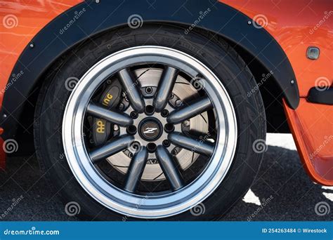Details On The Wheels Of A Classic Orange Japanese Datsun 240z Parked