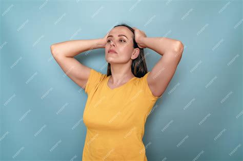 Premium Photo Woman Holding Hands Behind Her Head Gathered Hair