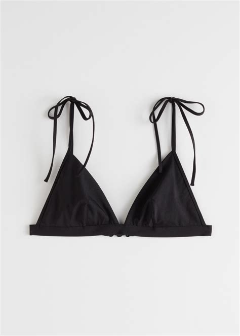 Kourtney Kardashian Dons Skimpy Black Bikini During Beach Getaway For