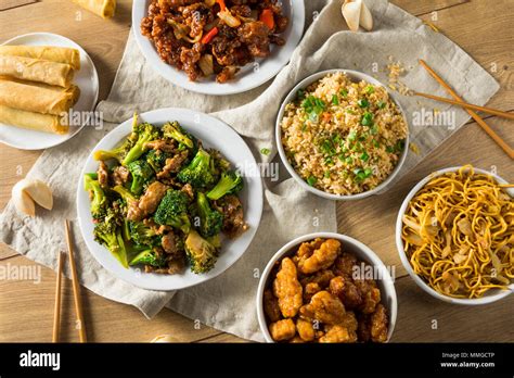 Spicy Chinese Take Out Food With Chopsticks And Fortune Cookies Stock