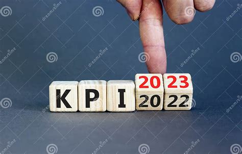 Kpi Key Performance Indicator Symbol Businessman Turns Wooden Cubes