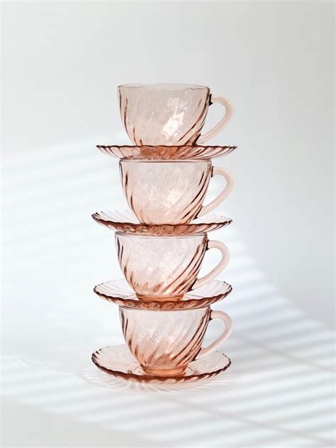 Four Glass Cups Stacked On Top Of Each Other