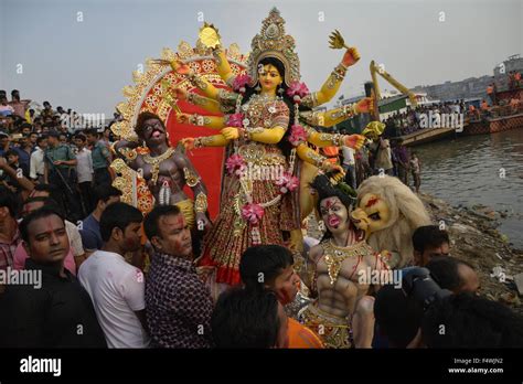 Bangladeshi Hindu Devotees Prepare To Submerge A Clay Idol Of The Hindu