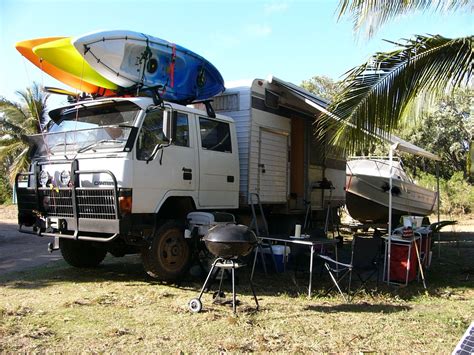 Box truck chassis with camper trailer body mounted on frame ...