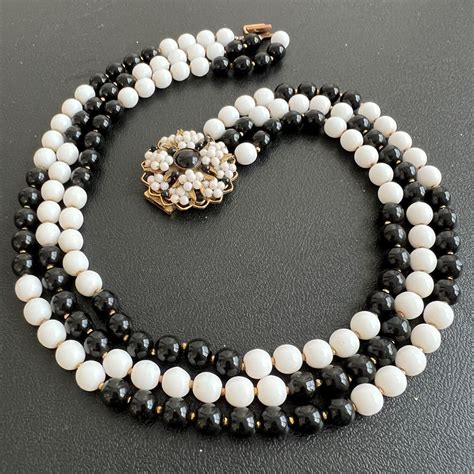 A Signed Original By Robert Vintage Onyx Milk Glass Bead Flower Clasp