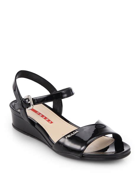 Lyst Prada Crisscross Patent Leather Wedge Sandals In Black