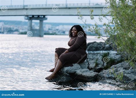 Smiling Pretty Curly Black Haired Plump African American Interracial