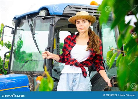 Portrait of a Positive Farm Girl Standing Near the Tractor Cab Stock Image - Image of scene ...