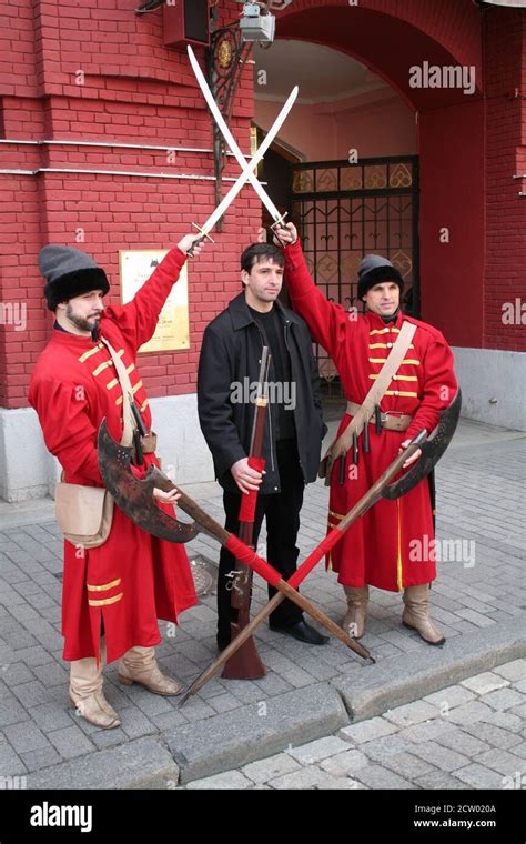 Visitor Poses With Men Dressed As Streltsy Soldiers Outside The State