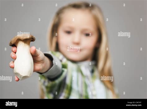 Girl Holding Mushroom Stock Photo Alamy