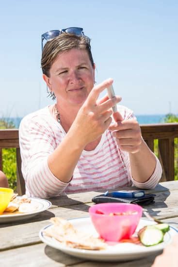 Mature Diabetic Woman Checking Her Blood Level Photos By Canva
